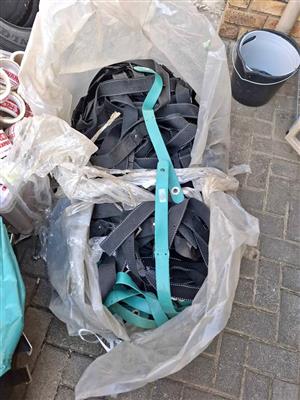 Heavy duty webbing straps and plastic straps for sale as a lot.