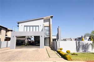 Sophisticated Glass-Fronted Home with Designer Finishes in Zambezi Manor Lifestyle Estate.