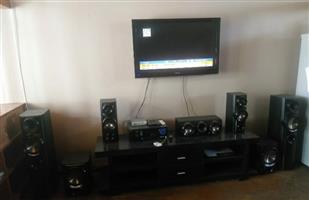 Hisense 42'inch TV - 2 x USB ports with HDMI. Black TV stand and LG sound system