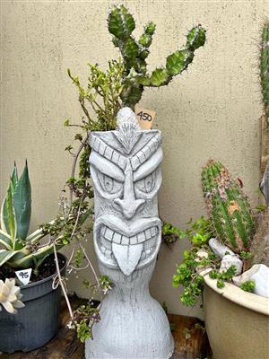 Head planter with a cactus plant