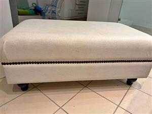Ostrich white leather ottoman size  600 w x 1.1m L x 500 H. Collection in Seapoint.