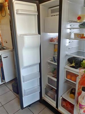 Samsung side by side Mirror fridge with water and ice dispenser for sale.