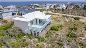Spacious Double-Storey Property in Pringle Bay’s Point Area with Ocean Views and Flatlets For Sale