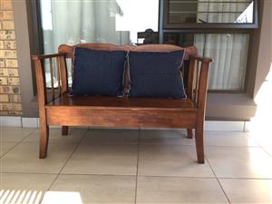 Wooden bench and cushions