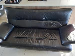 Black leather couch in usable condition
