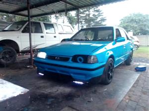 Selling mazda have papers car start an drive just need som tlc