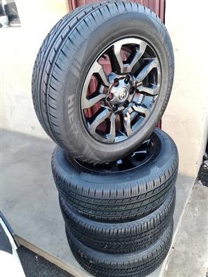 18" Toyota Legend 50 mags with brand new 265/60/18 Dunlop Grandtrek A/T set 
