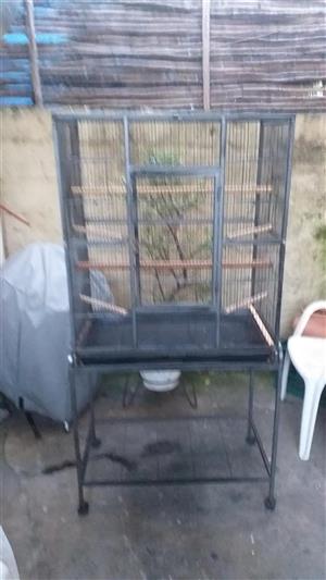 Used Bird cage on trolley with wheels.  
