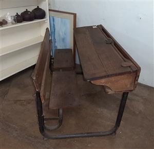 Old, oak and metal school desk with compartment