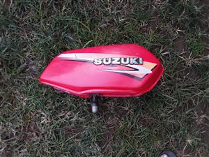 Petrol Tank for Suzuki Motor Bike. As good as new. With the fuel tap and filter. And the Fuel Cap.
