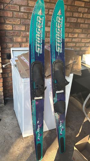 Skis, lifejackets, tubes, gym equipment, bed, bar