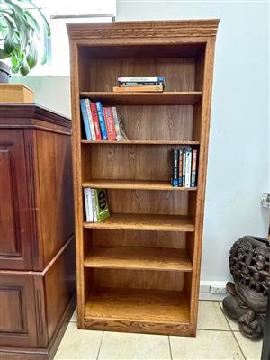 Oak finish open bookcase with adjustable shelves