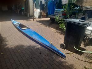 Two canoes one racing one fishing