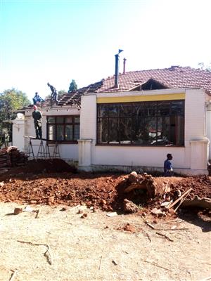 Stripping of old wooden floors and replacing with concrete floors 