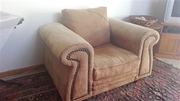 Brown suede one seater couch