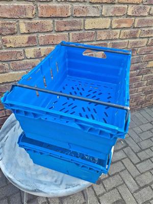 Blue stackable crates for sale.