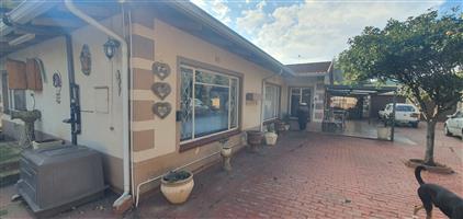 Main home with 2 flats and small commercial buildin