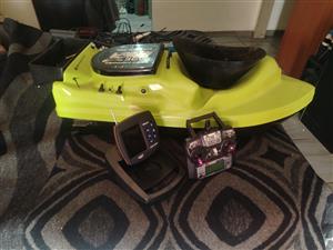 Bait boat and fish finder. Withe remote the remote needs 2 part but they are dea