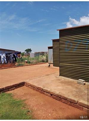 A stand with a 3 rooms zozo for sale in Orange  Farm next to Palm Springs Mall.