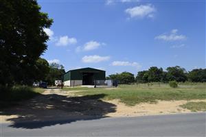 Prime Plot Property on Busy Road – 22,000 m²