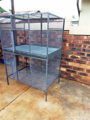  Double Parrot cage with trays. Call 
