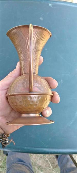 a vintage hammered copper vasejug
