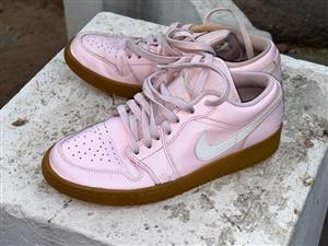 Pink low tops  ladies NIKE JORDANS with gums. BOUGHT IN THE USA.