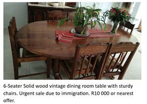 6-Seater Solid wood vintage dining room table with sturdy chairs.