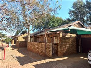 Charming 3-Bedroom Townhouse in Secure Complex with Covered Patio