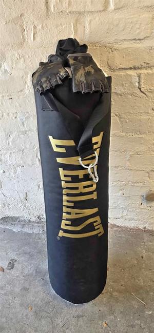 Boxing bag with gloves and wrist weights