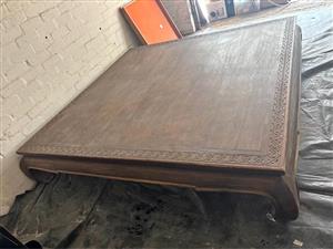 Solid Wooden square table-Size 200x 200x 40height. Good condition but has a few scratches on