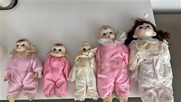 5 porcelain dolls