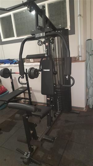 Trojan elite 1.0 power gym with 90 kg weights like new.