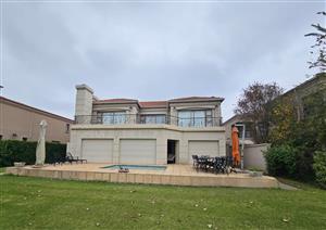 Absolutely Stunning Riverfront Home for Sale in Secure Estate!