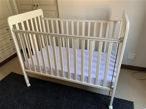 White wooden cot including mattress 