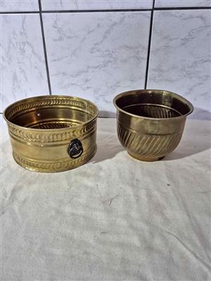 Vintage brass planters, likely antique or mid-century brass decorative plant pots.