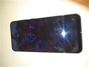 Samsung A30S cell phone . Includes Samsung Charger, headphones & new Screen Prot