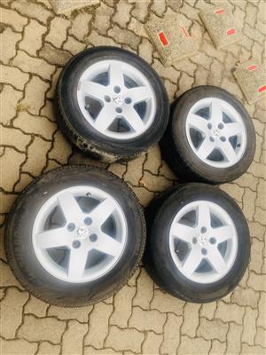 Peugeot 15 inch rims and tyres for sale in good condition set of 4