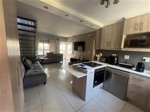 A Sophisticated Duplex Retreat Where Style Meets Convenience