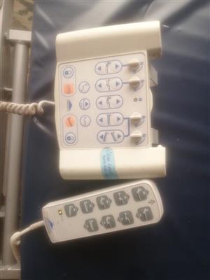 4 way motor controlled hospital bed.  New matras Clean condition. 
