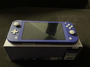 Nintendo Switch Lite +  CHARGER AND 32 SD CARD