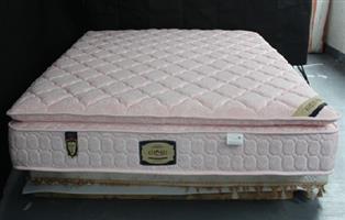 King size double bed with two mattresses. Includes headboard. 