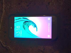 Samsung Galaxy j 2 with cover no charger needs new screen protector cracked 
