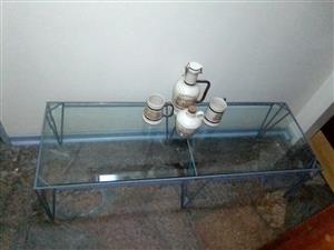 Coffee table , steel frame with glass top it is 1.54 m long 40cm high 60 cm wide