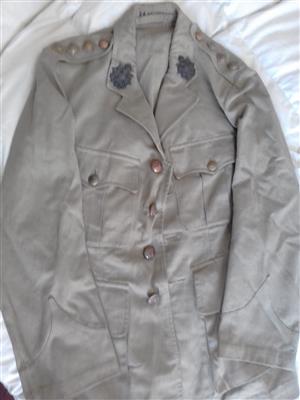 World War II army jacket with buttons and badges; also WWI medal
