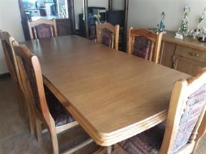 extending dining room table and 6 chairs