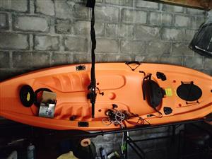Fishing kayak  with paddle and life jacket 