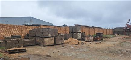 Yard sale consisting of building material, vehicles and machinery.