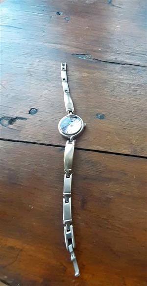 Vintage Ladies watch with pink dial and silvertone band.  