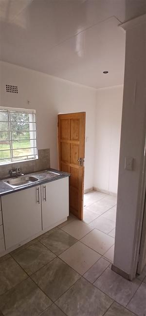 1 bedroom attached house with open plan kitchen and lounge